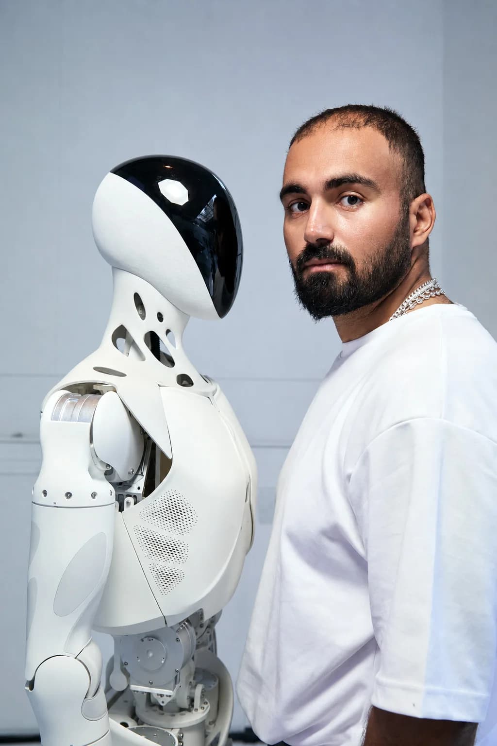 Anis Ayari with a humanoid robot